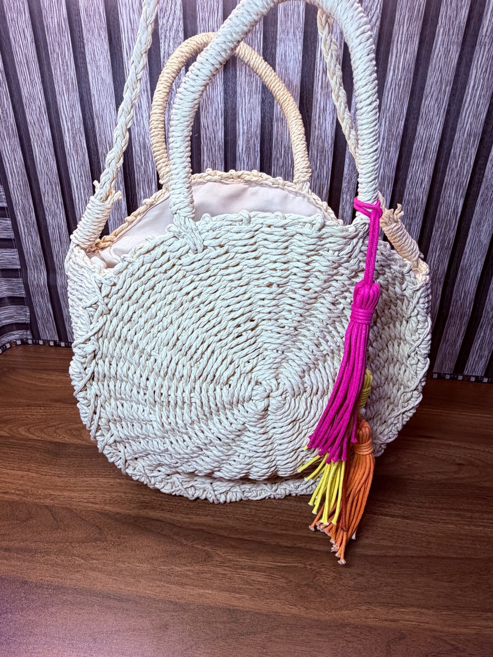 Handwoven Round Cream Tote with Multicolor Tassel Accent